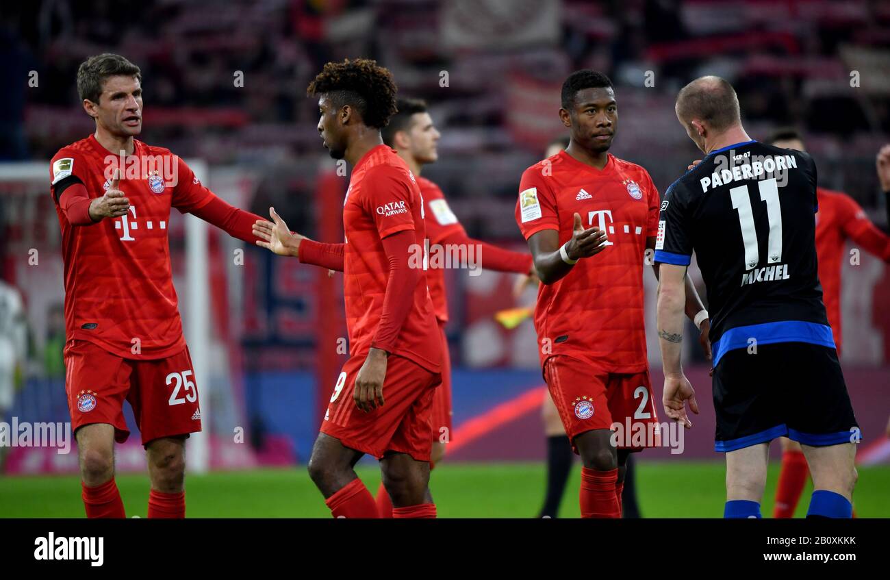Munich, Germany. 21st Feb, 2020. Football: Bundesliga, Bayern Munich - SC Paderborn 07, 23rd matchday in the Allianz Arena. Thomas Müller (l-r), Alphonso Davies, David Alaba from FC Bayern Munich and Sven Michel from Paderborn after final whistle. Credit: Peter Kneffel/dpa - IMPORTANT NOTE: In accordance with the regulations of the DFL Deutsche Fußball Liga and the DFB Deutscher Fußball-Bund, it is prohibited to exploit or have exploited in the stadium and/or from the game taken photographs in the form of sequence images and/or video-like photo series./dpa/Alamy Live News Stock Photo