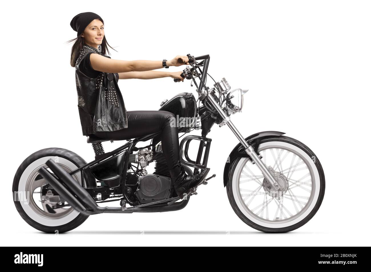 Female biker on a custom black chopper isolated on white background Stock Photo