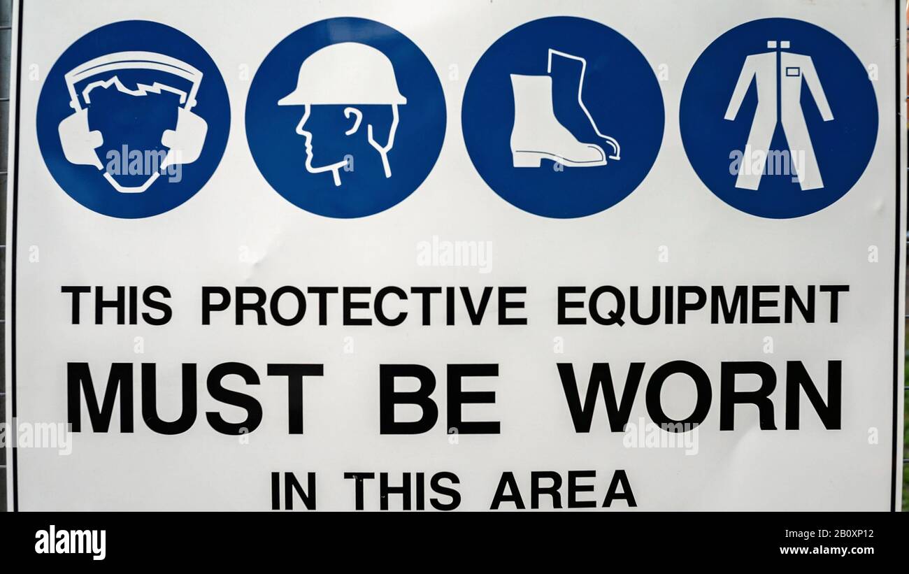 Protective Equipment Must Be Worn In This Area signage on work site Stock Photo