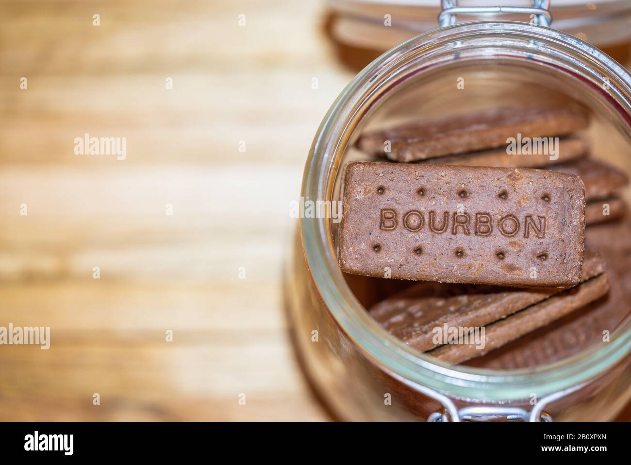 An open glass jar with Bourbon chocolate biscuits inside Stock Photo