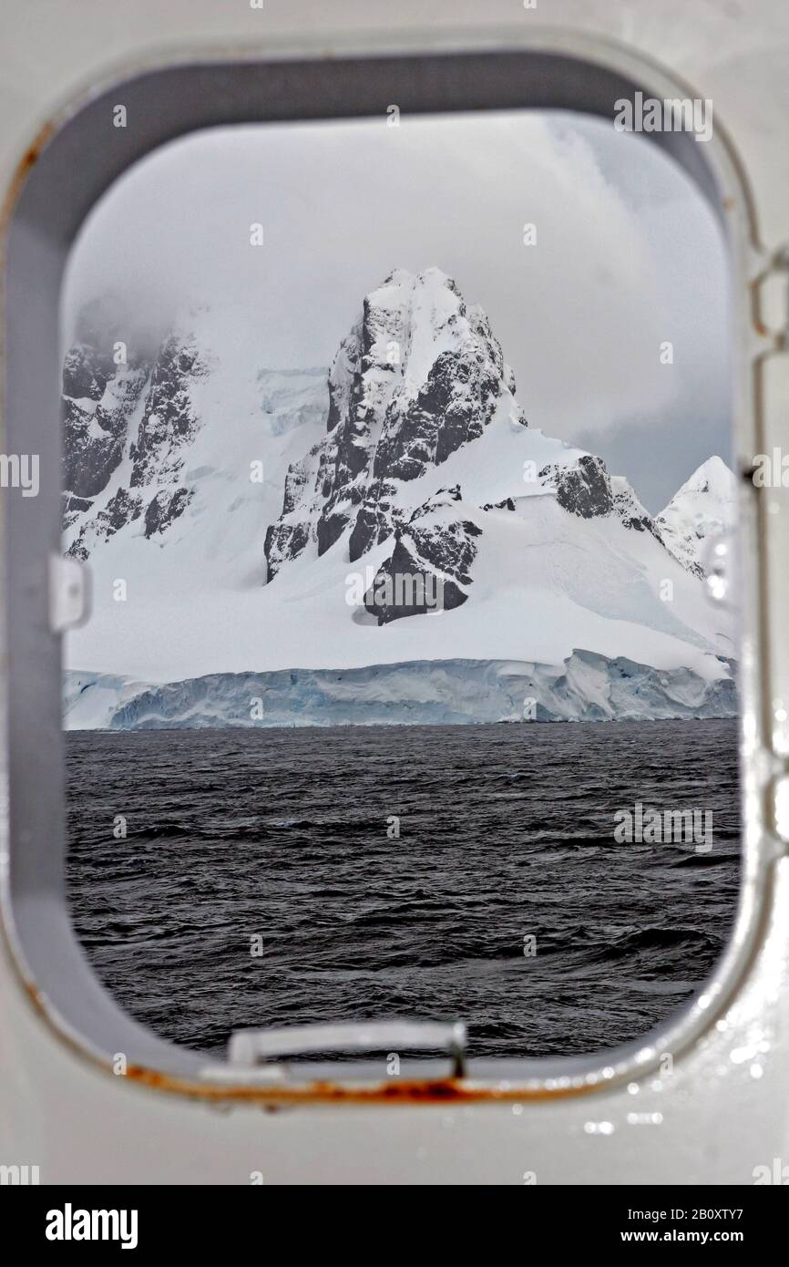 view through a porthole to the coast, Antarctica, Suedpolarmeer Stock Photo