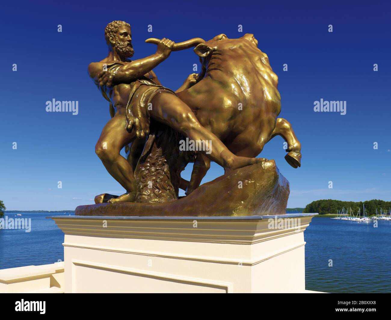 Sculpture of Heracles taming the Cretan bull with Lake Schwerin, Schwerin, Mecklenburg-West Pomerania, Germany, Stock Photo