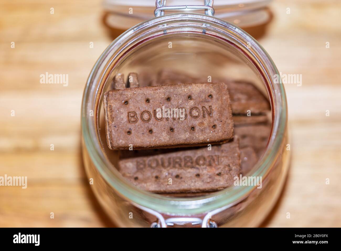 An open glass jar with Bourbon chocolate biscuits inside Stock Photo