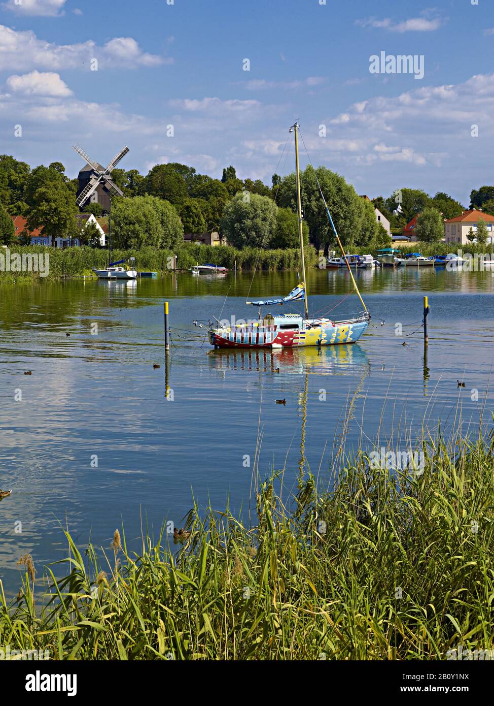 Historic city center with post mill and sailing boat 'Havelwunder' in Werder, Brandenburg, Germany, Stock Photo