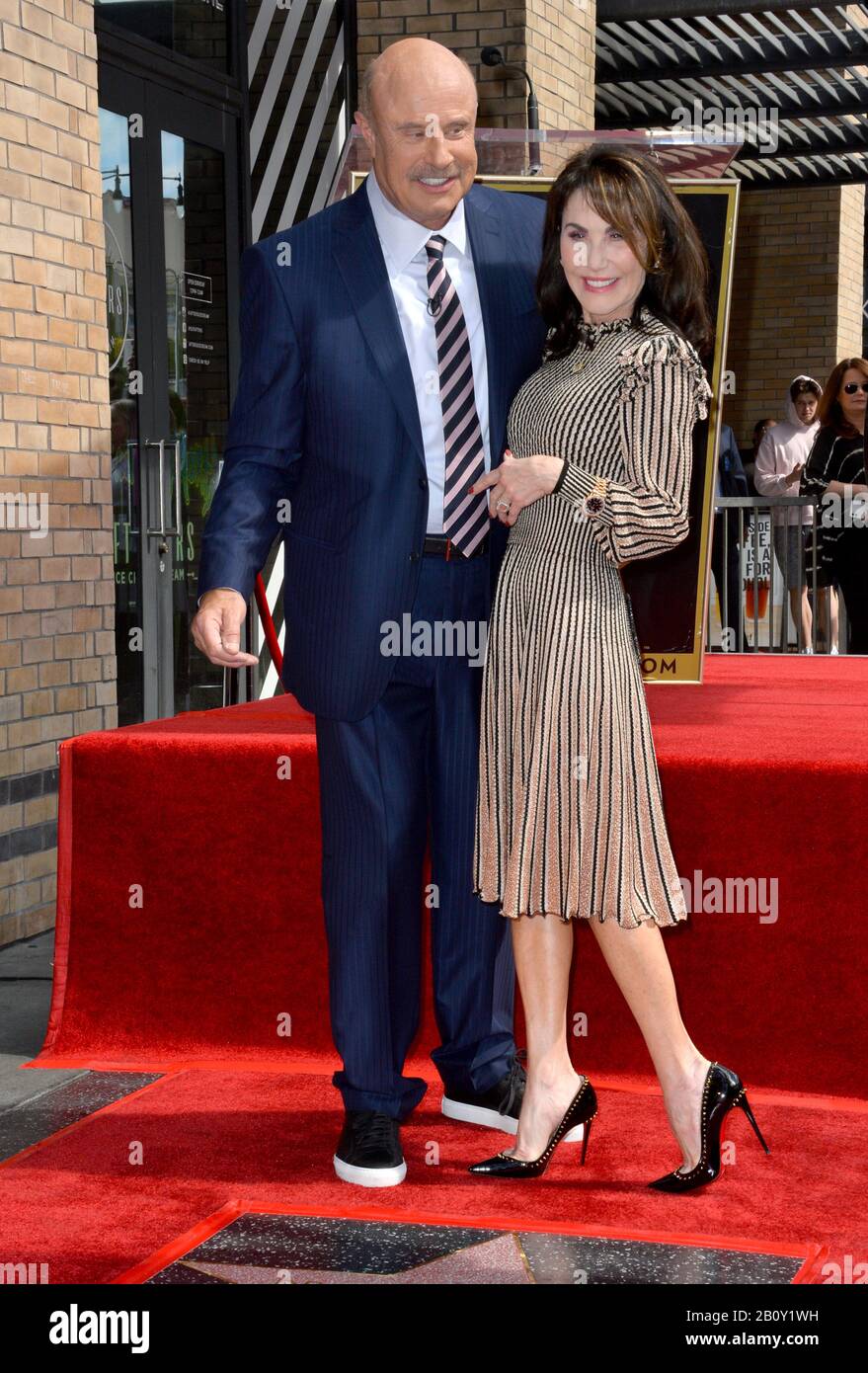 Los Angeles, USA. 21st Feb, 2020. LOS ANGELES, CA. February 21, 2020: Dr. Phil McGraw & Robin McGraw at the Hollywood Walk of Fame Star Ceremony honoring Dr Phil McGraw. Pictures Credit: Paul Smith/Alamy Live News Stock Photo
