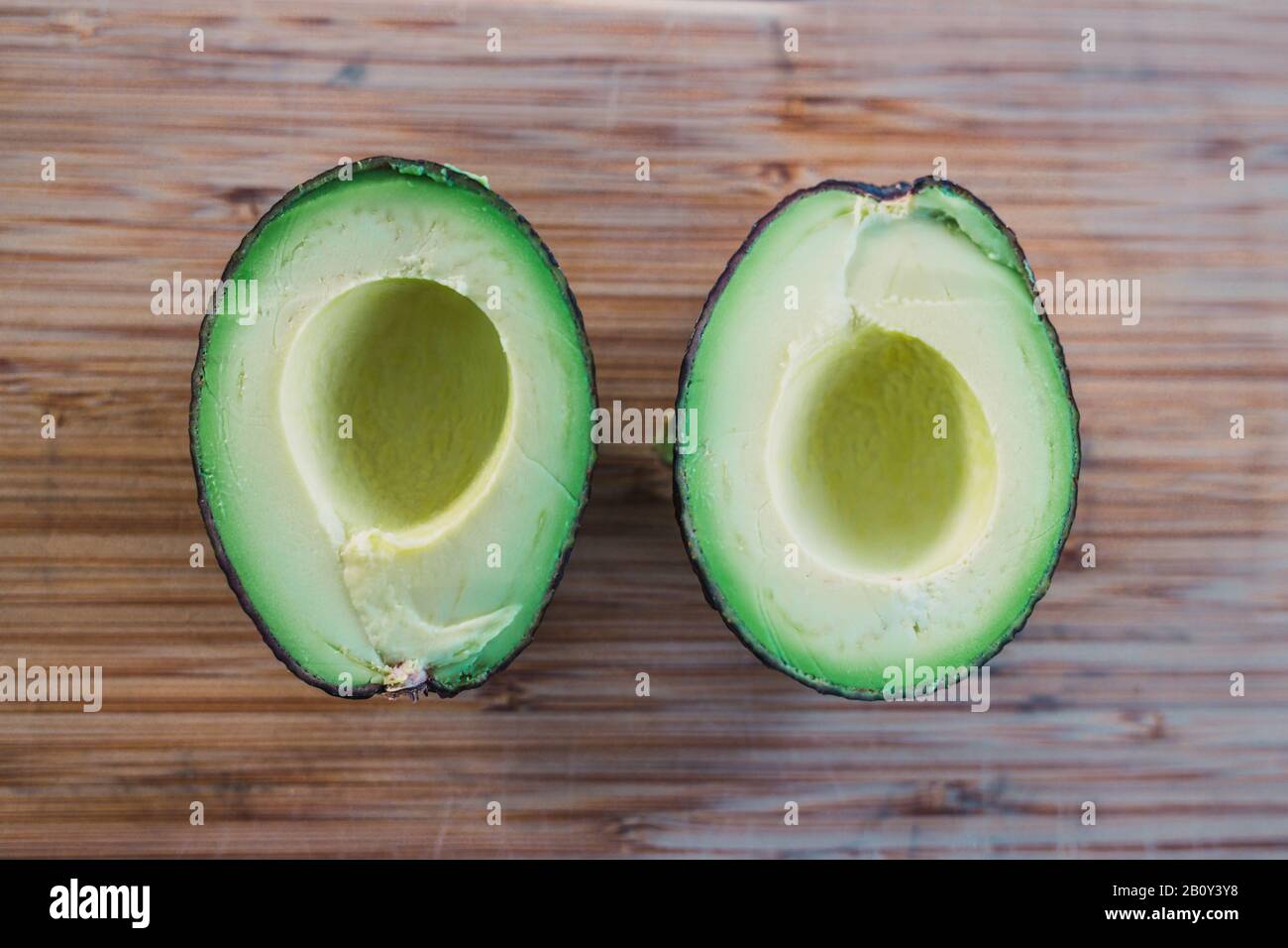 healthy ingredients for a plantbased diet, avocado cut in halves on
