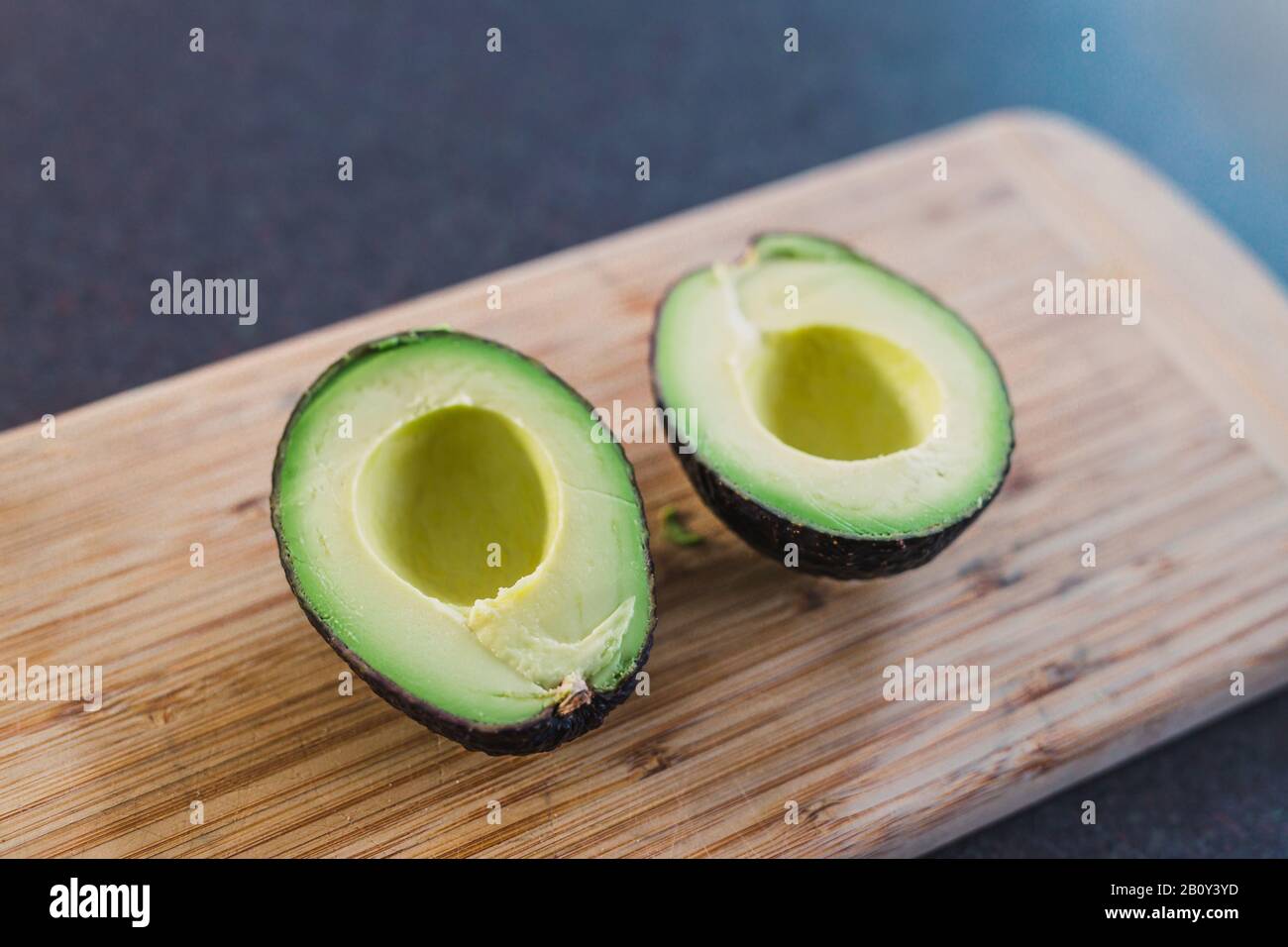 healthy ingredients for a plantbased diet, avocado cut in halves on