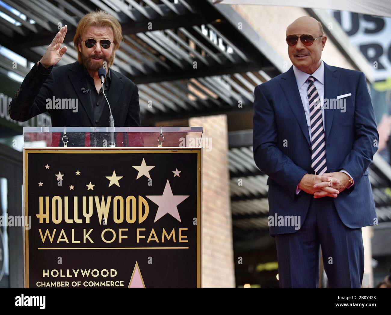 Los Angeles, United States. 21st Feb, 2020. Ronnie Dunn (L) speaks at the star unveiling ceremony honoring Dr. Phil McGraw with the 2,688th star on the Hollywood Walk of Fame in Los Angeles, California on February 21, 2020. Photo by Chris Chew/UPI Credit: UPI/Alamy Live News Stock Photo
