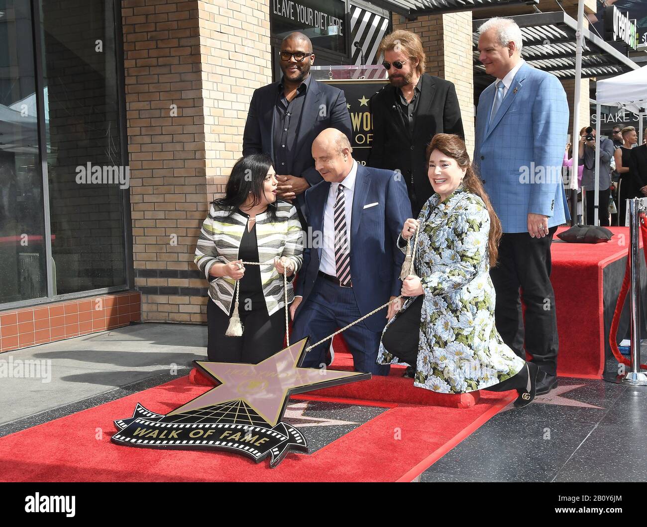 (L-R) Rana Ghadban, Tyler Perry, Dr. Phil McGraw, Ronnie Dunn, Donelle Dadigan and Guest at the Dr. Phil McGraw Star On The Hollywood Walk Of Fame Ceremony held in front of the Eastown Development in Hollywood, CA on Friday, February 21, 2020 (Photo By Sthanlee B. Mirador/Sipa USA) Stock Photo