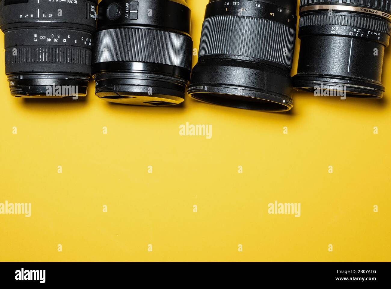 photography lenses with a yellow background Stock Photo Alamy