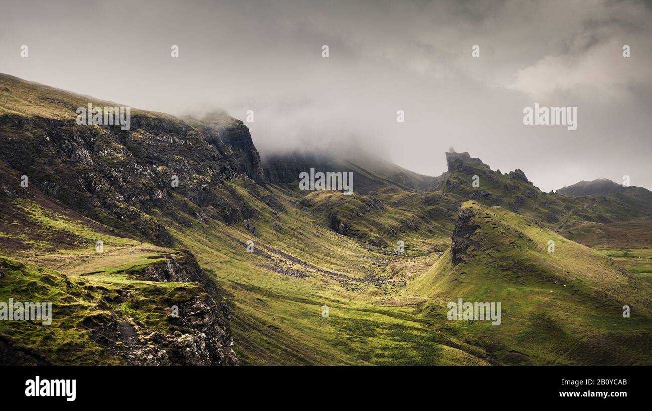 Quiraing landslide in the morning mist, Meall na Suiramach, Trotternish Ridge, Isle of Skye, Scotland, UK, Stock Photo