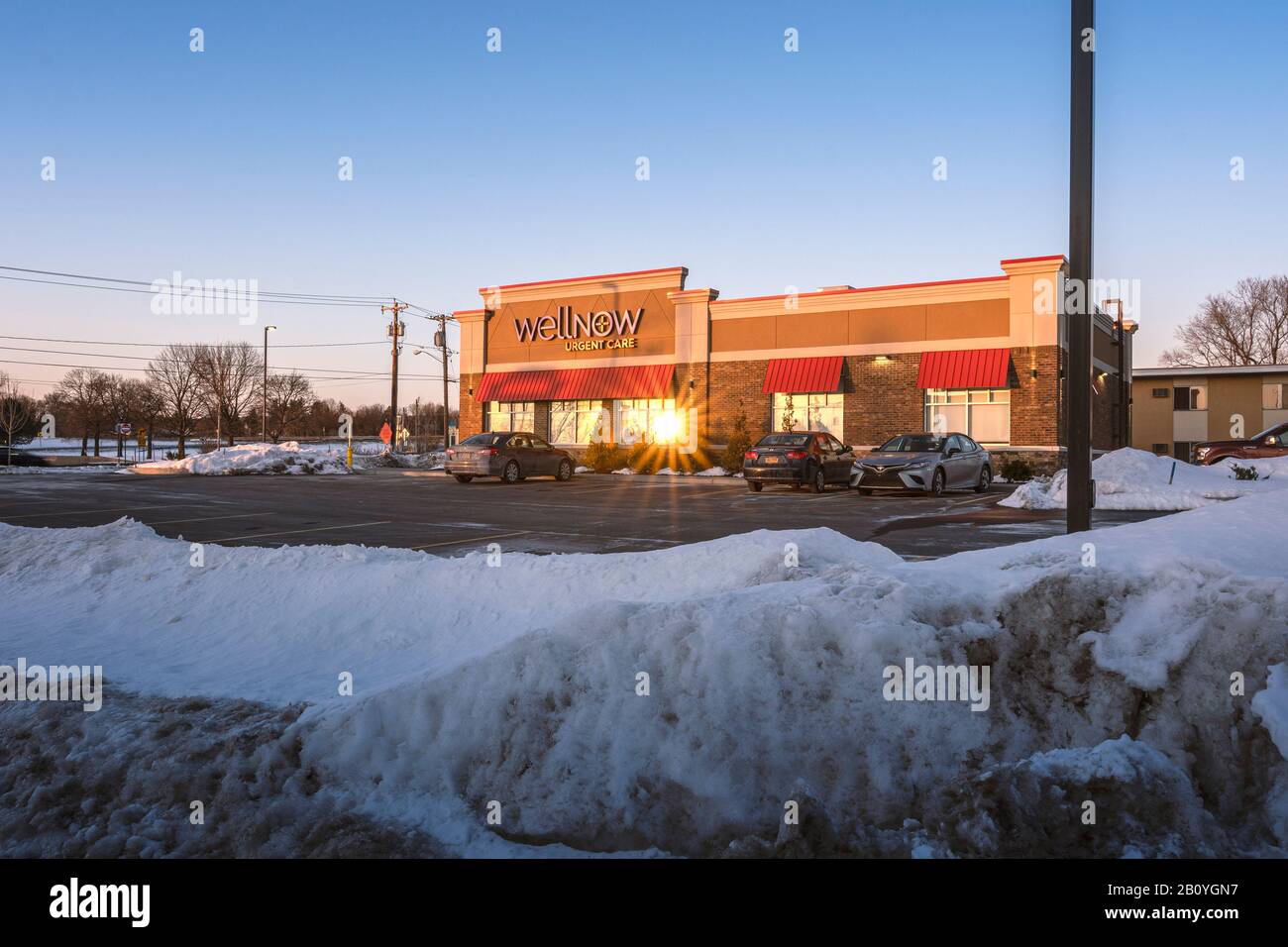 Utica, New York - Feb 21, 2020: Evening View of WellNow Urgent Care, Formerly Five Star Urgent Care, is a Conglomerate of Walk-in Urgent Care Clinics Stock Photo