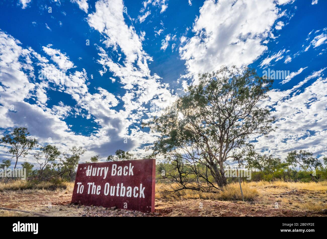 'Hurry Back To The Outback', sign at the city limits of Cloncurry by the side of the Flinders Hwy, Concurry, north-west Qoeensland, Australia Stock Photo
