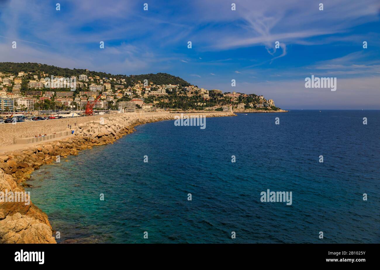 View of Nice coastline from the famous Promenade des Anglais with the Mediterranean Sea and Lympia Port in the background, Cote d'Azur, France Stock Photo