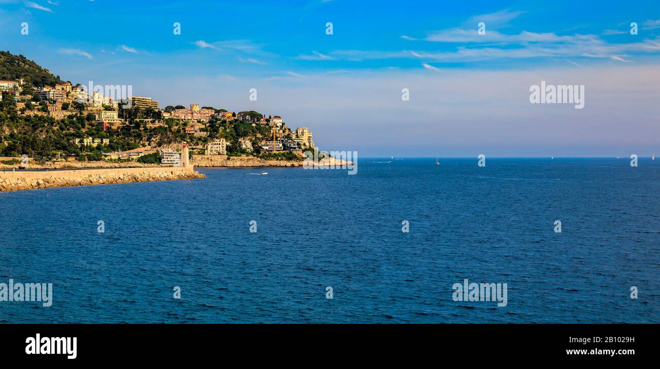 Panorama of Nice coastline from the famous Promenade des Anglais with the Mediterranean Sea and Lympia Port in the background, Cote d'Azur, France Stock Photo