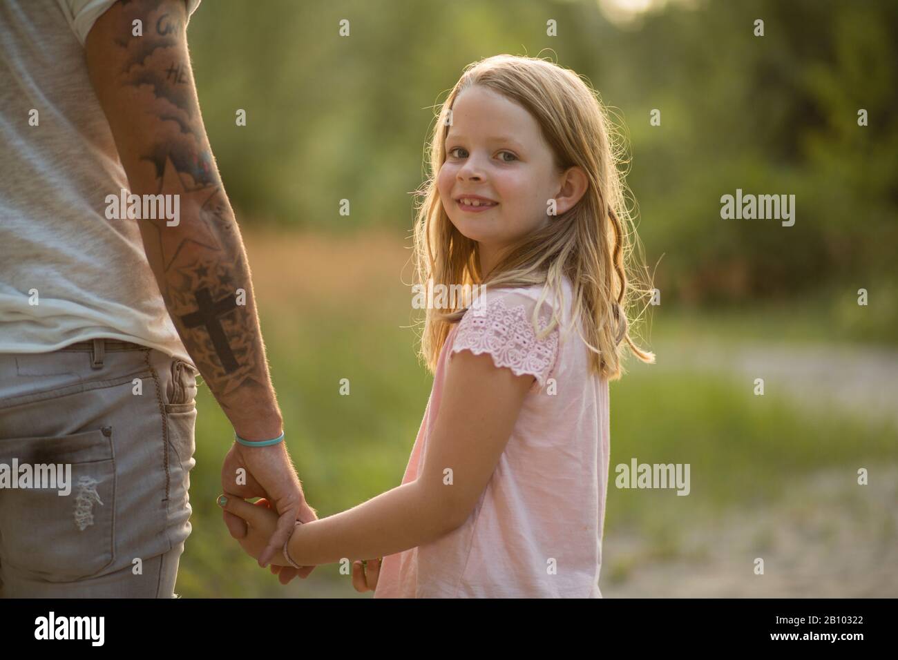 Father and daughter together in the forest Stock Photo - Alamy