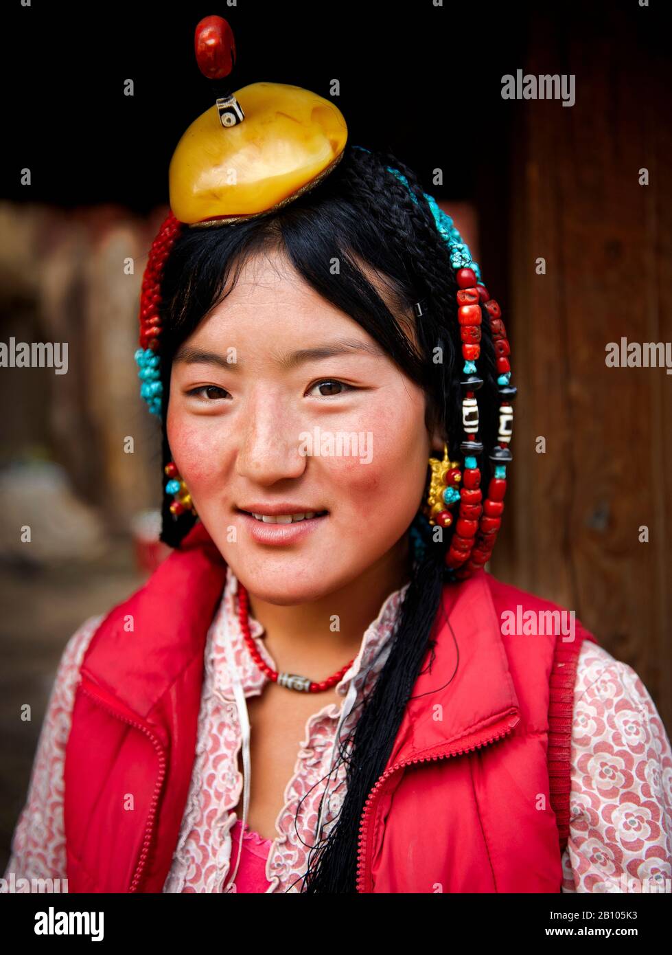 Some families strive to preserve their traditions. Customs and way of dressing and accesories are from generation to generation. Remote Tibetan plateau Stock Photo