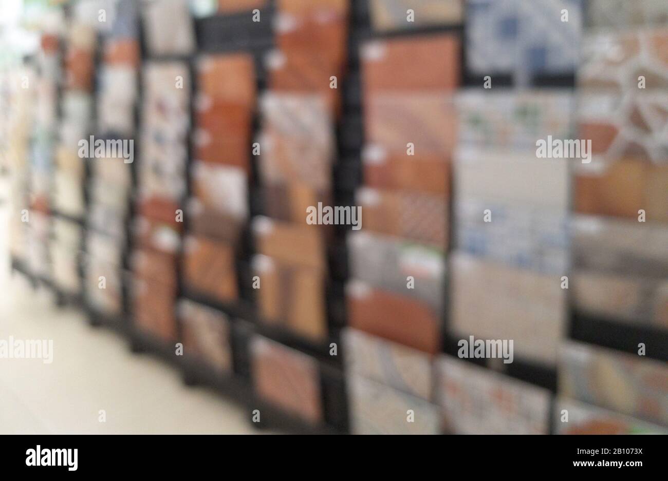 Shelf with tiles in hardware store blurred background Stock Photo