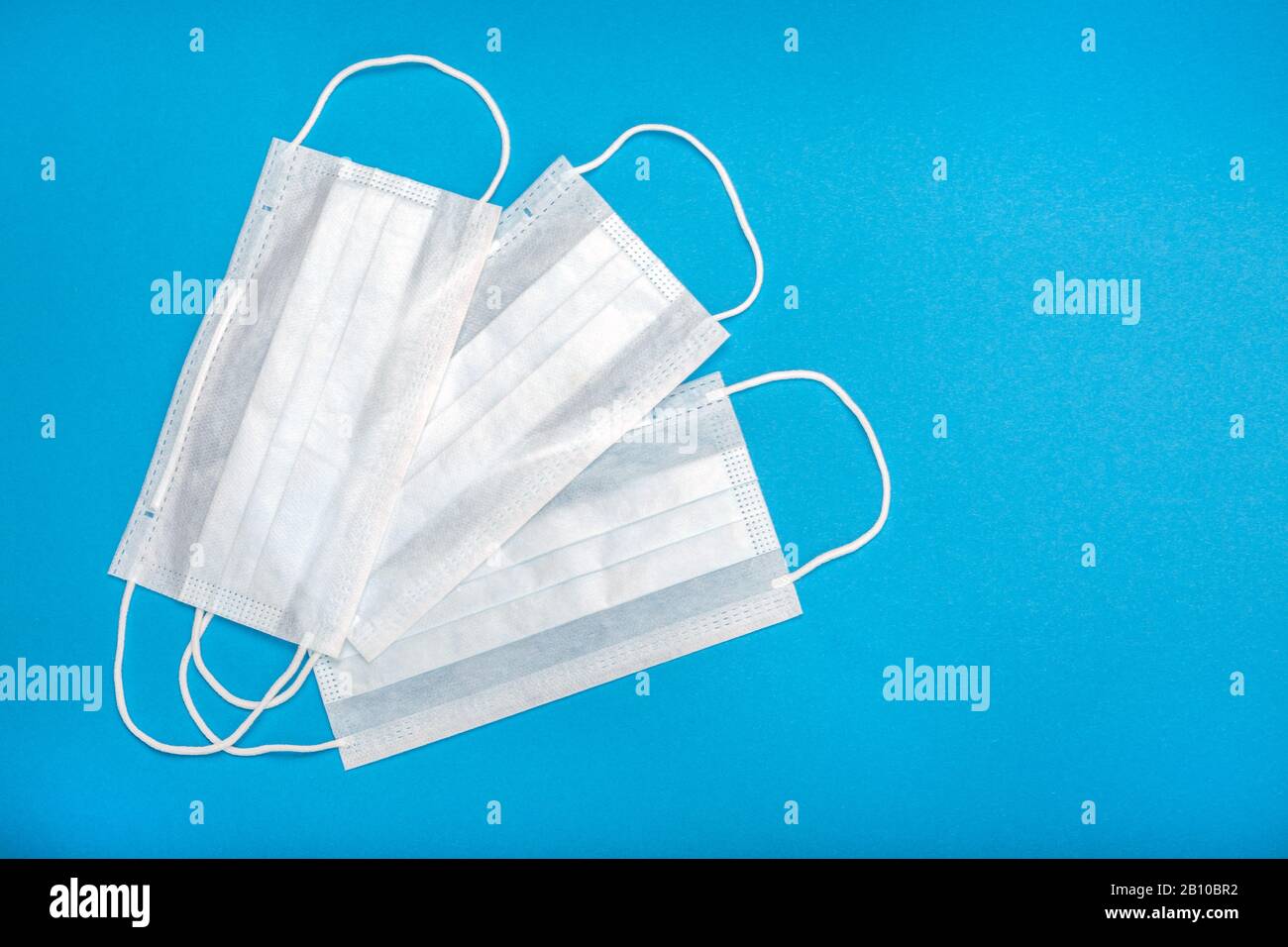 Three surgical masks with rubber ear straps. Typical 3ply surgical