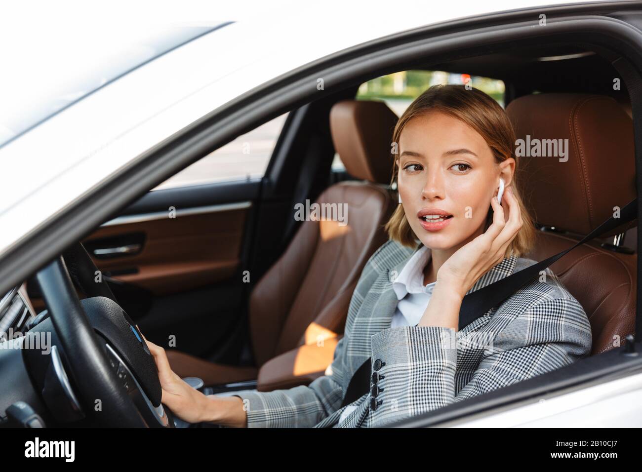 Image of young caucasian successful businesslike woman in formal wear