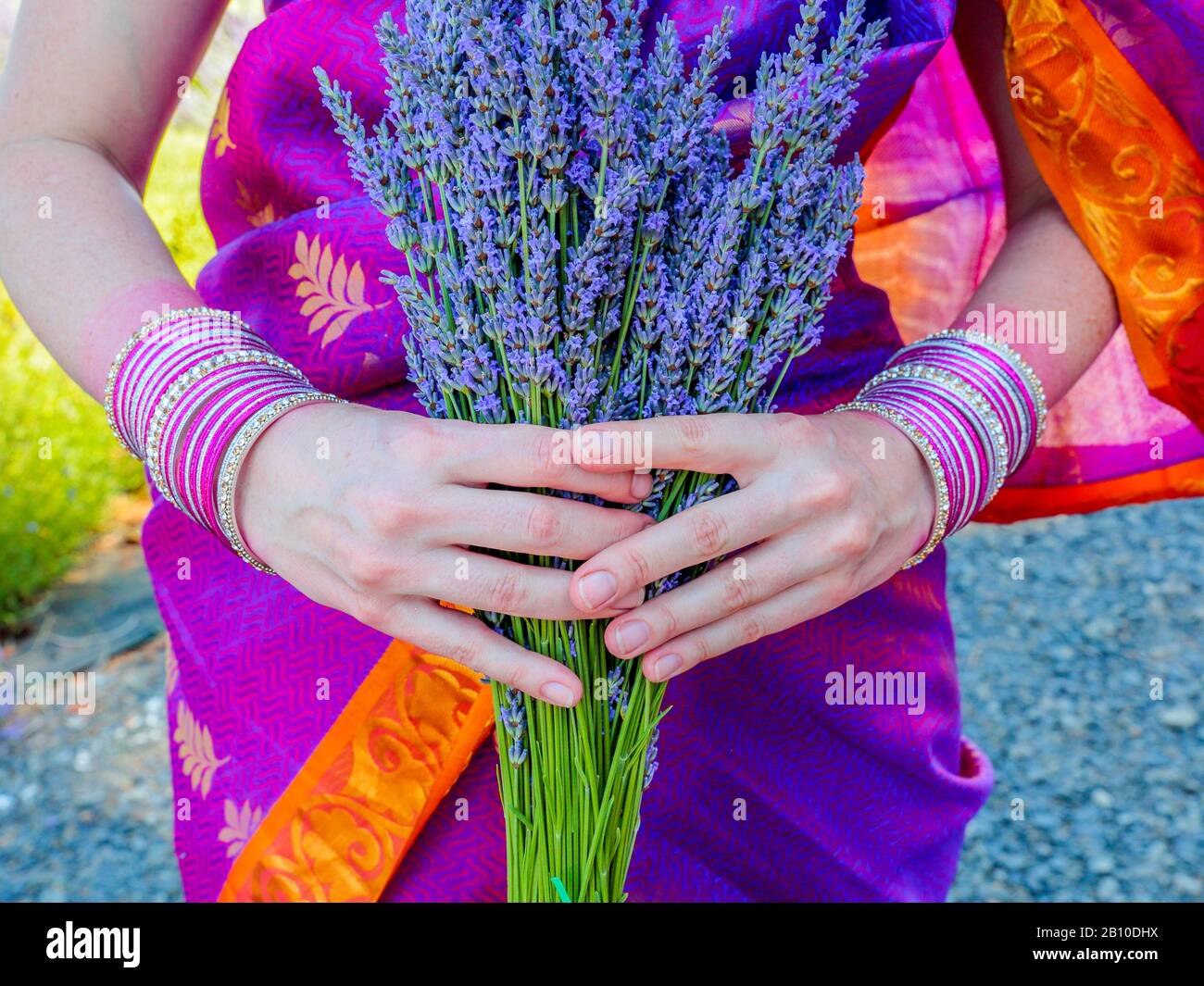 Hand wearing bracelets hi-res stock photography and images - Alamy