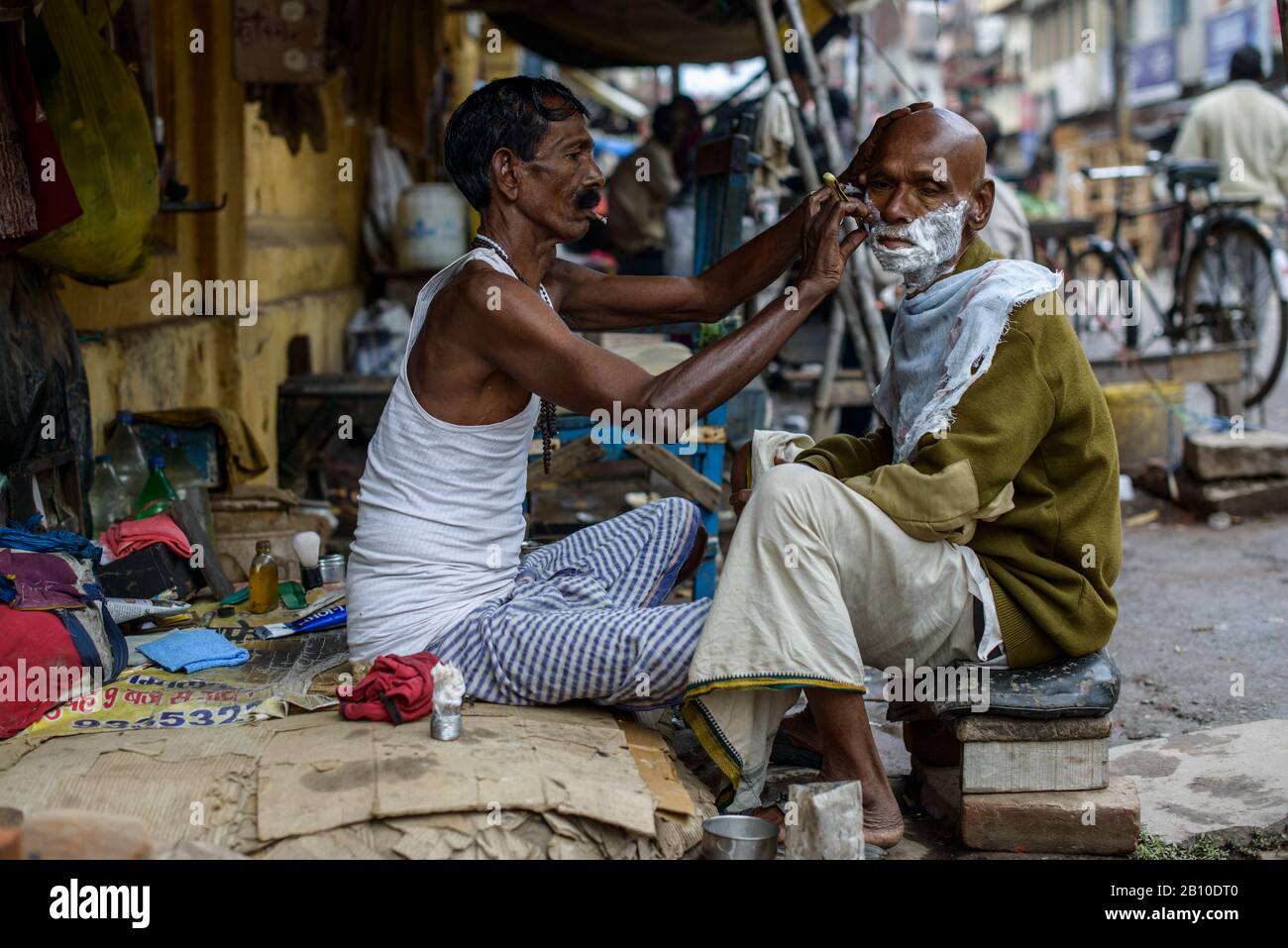 Barbers on the streets of Varanasi, India Stock Photo