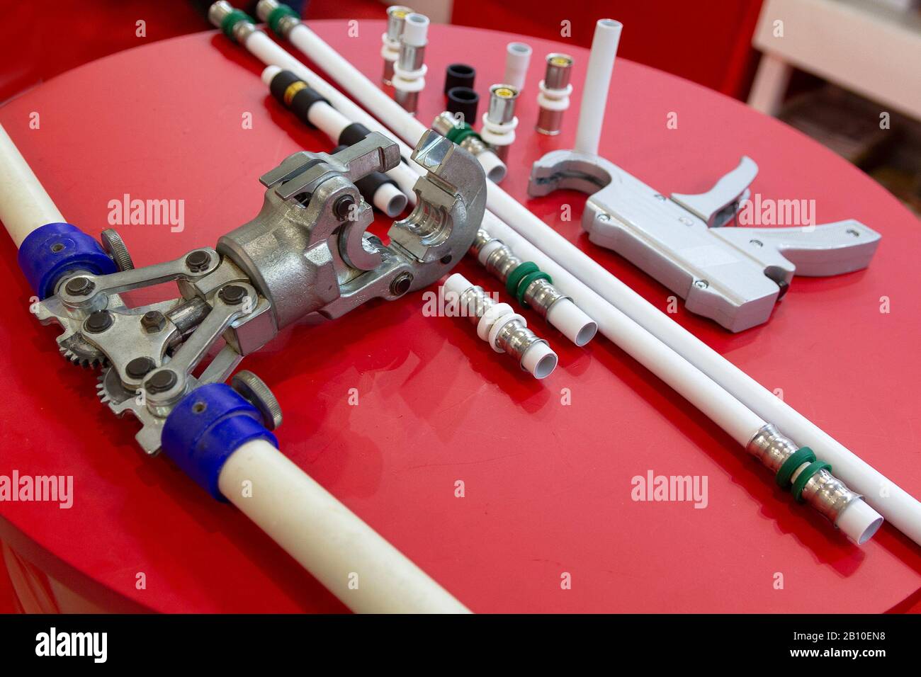 Water metalplastic pipes and tools for press fittings on the table
