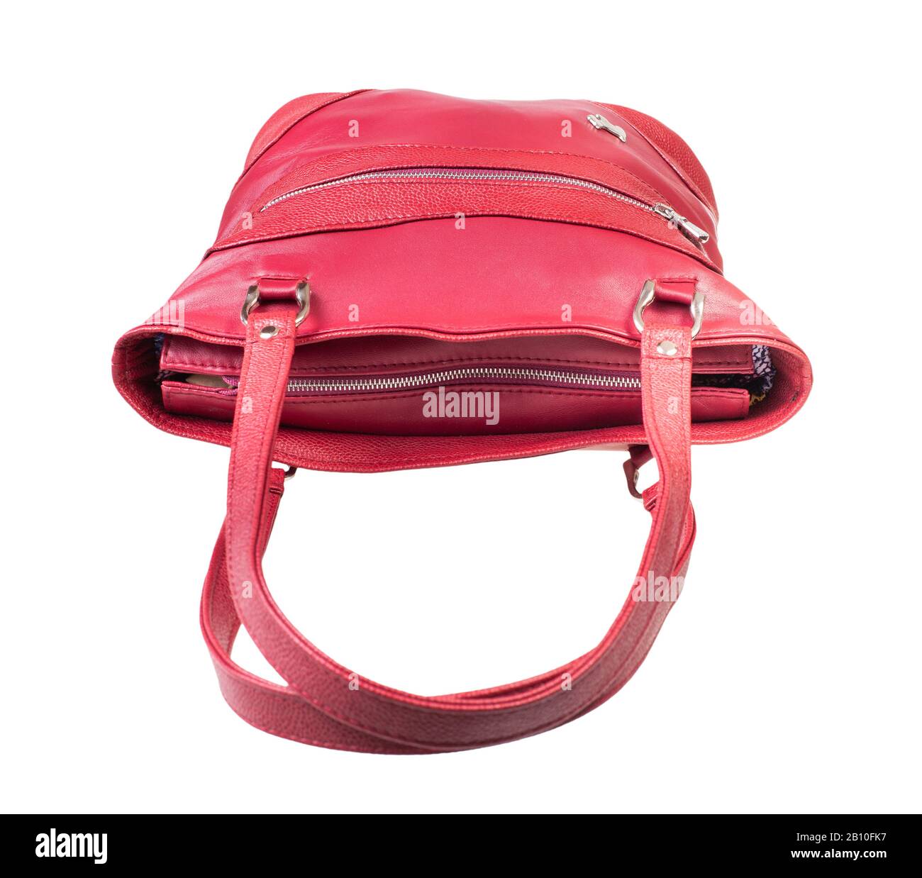 closed red handbag with top zipper handmade from natural leather isolated on white background Stock Photo