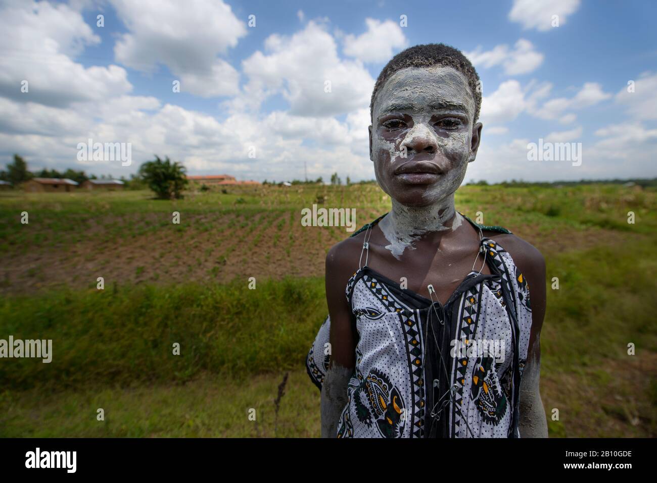 Adolescent covered in chalk dust, during the month before her circumcision, ritual to enter into adulthood, West Kenya, Africa Stock Photo