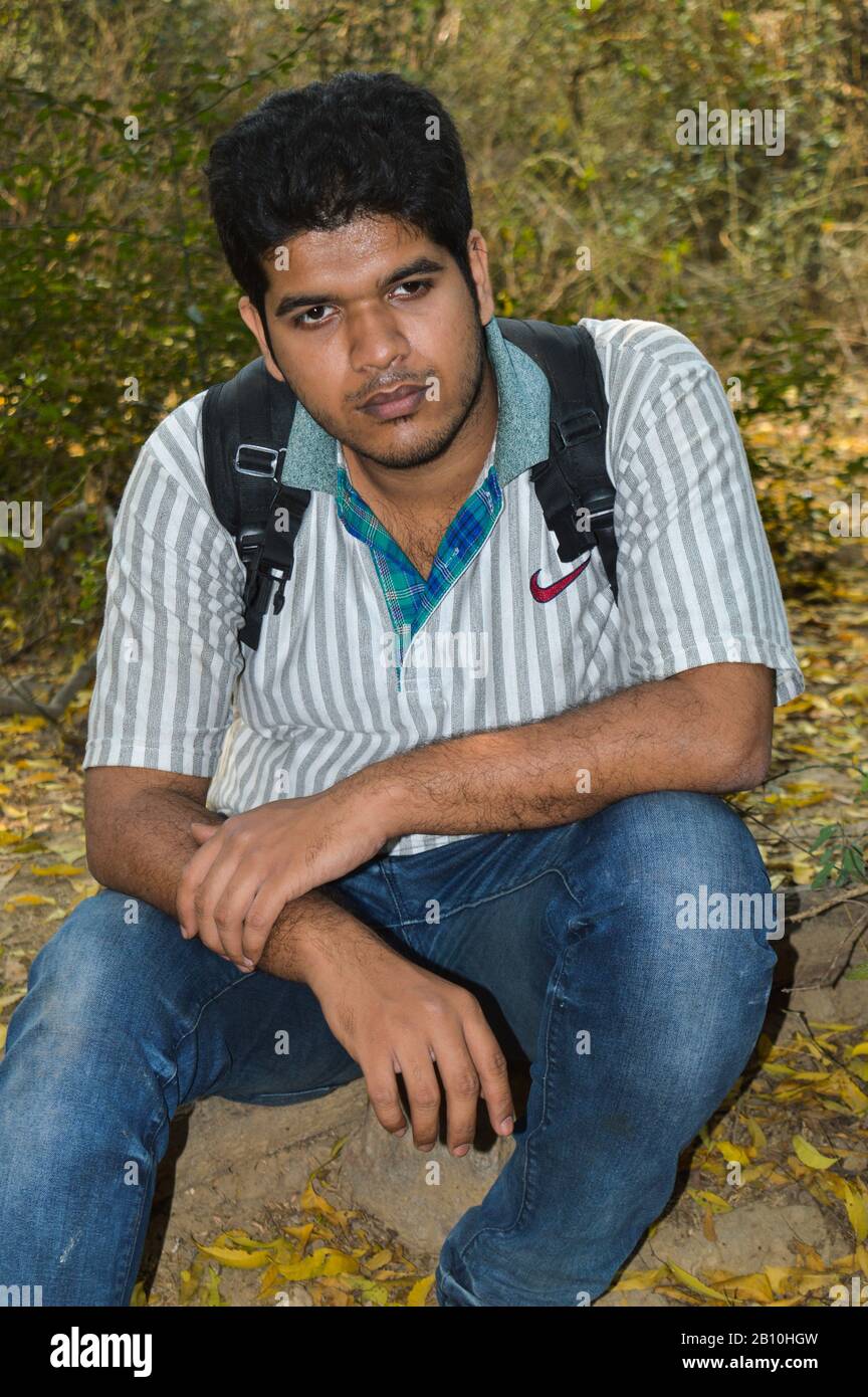 A Indian guy,boy with nikon camera D750 doing photo shoot and posing inside  of garden and lake at morning Stock Photo - Alamy