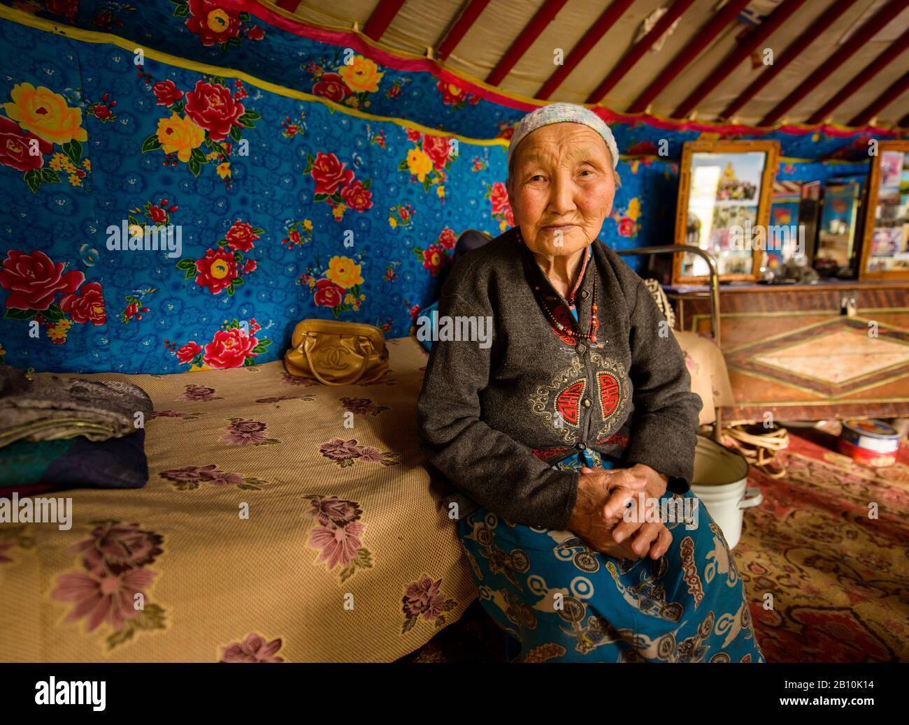 Old Mongolian nomad in her yurt, Mongolia Stock Photo