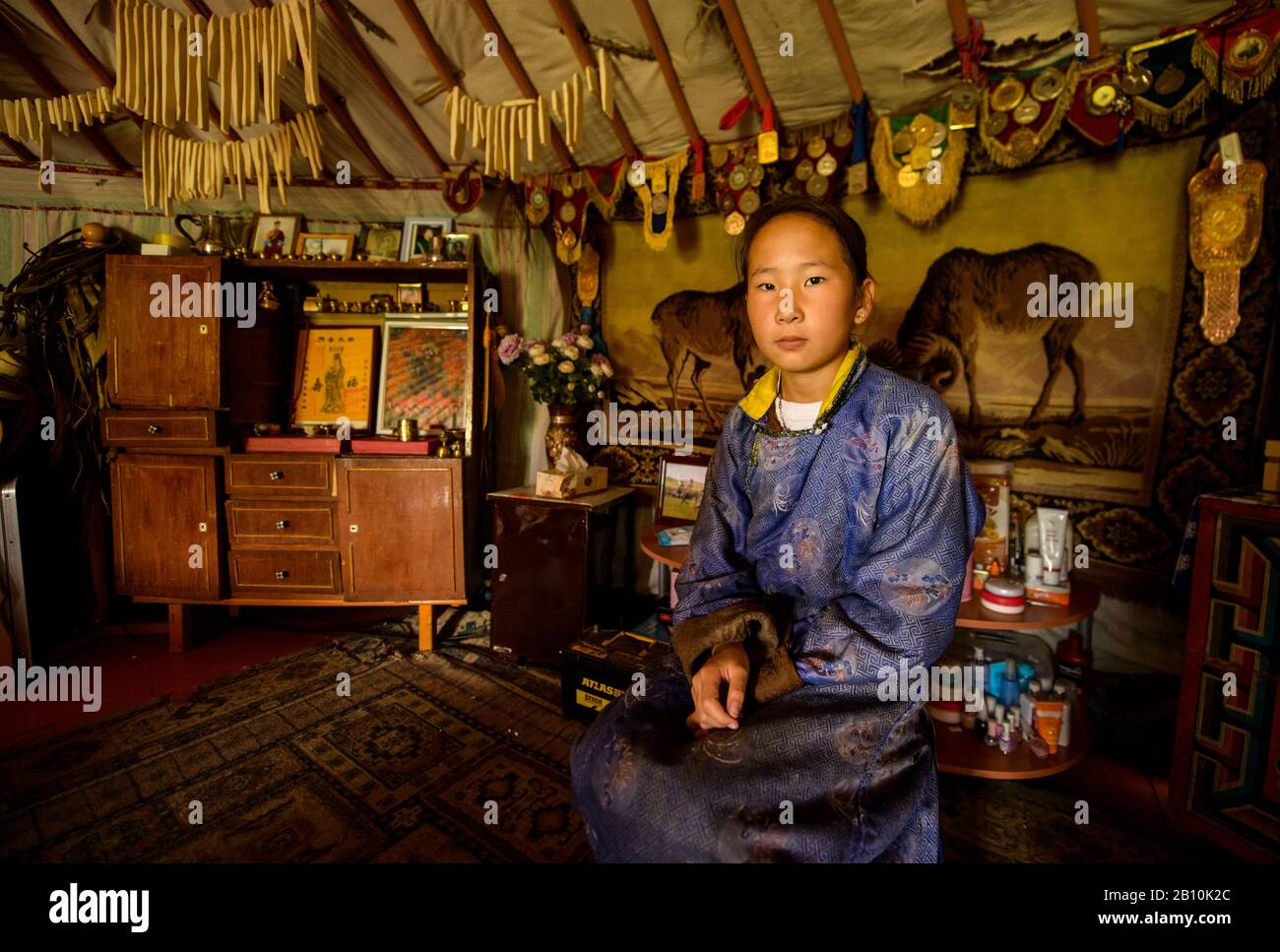 Mongolian nomad girl in her yurt, Mongolia Stock Photo