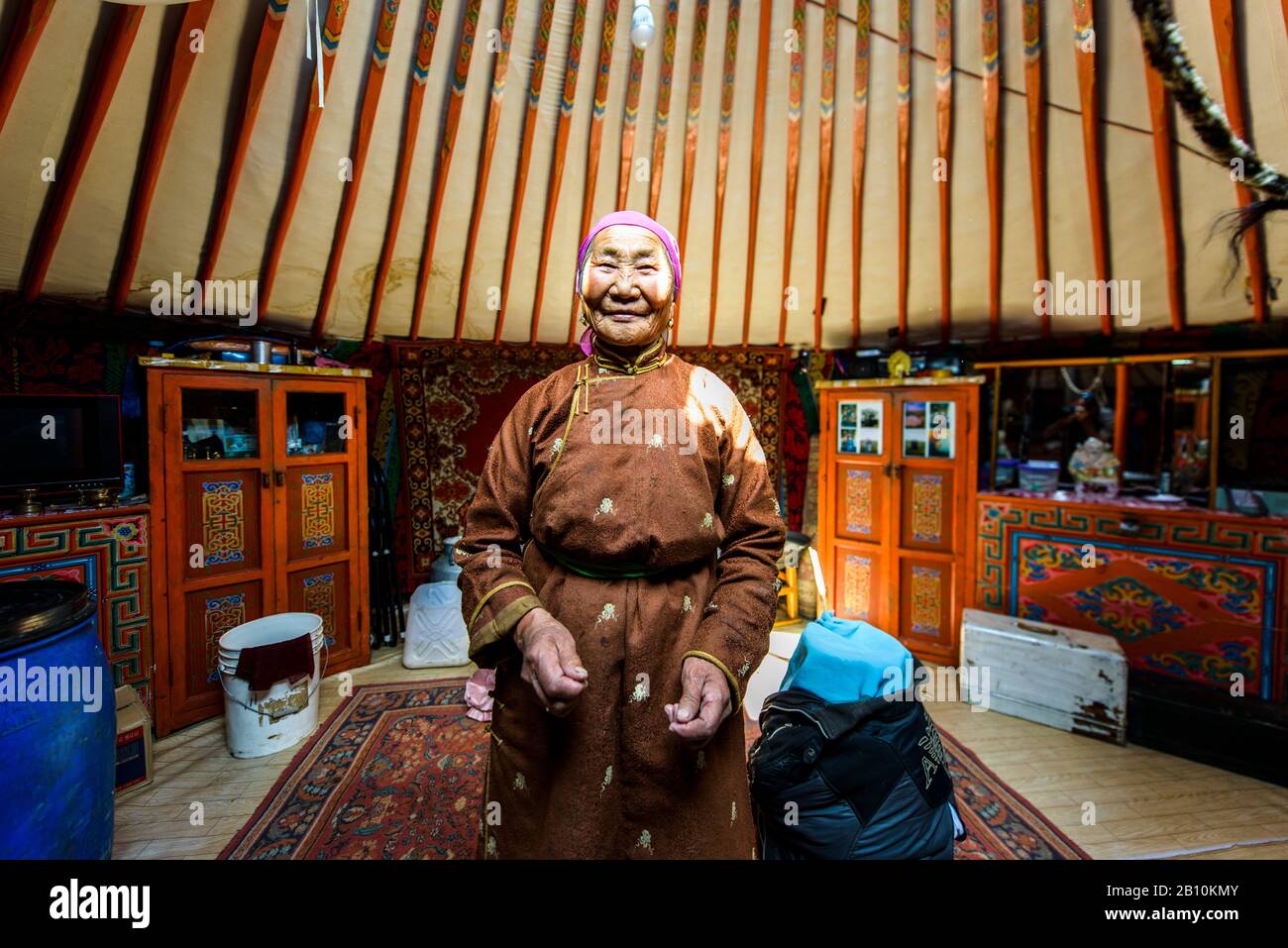 Mongolian nomad in her yurt, Mongolia Stock Photo