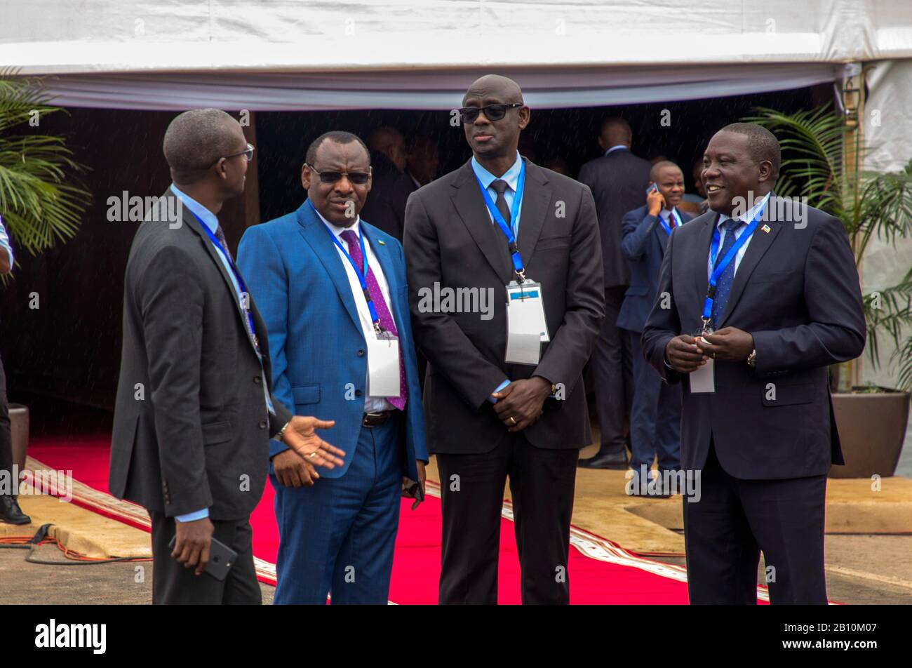 Kampala. 21st Feb, 2020. Senior Rwandan officials chat at the Gatuna-Katuna border crossing between Rwanda and Uganda before a meeting, on Feb. 21, 2020. The two countries on Friday signed an extradition treaty to ease tension as a common border between the two neighboring countries remains closed for over a year. The treaty, according to the communique issued at the end of the meeting has a legal framework to handle alleged subversive activities practiced by nationals in the territory of the other party. Credit: Cyril Ndegeya/Xinhua/Alamy Live News Stock Photo