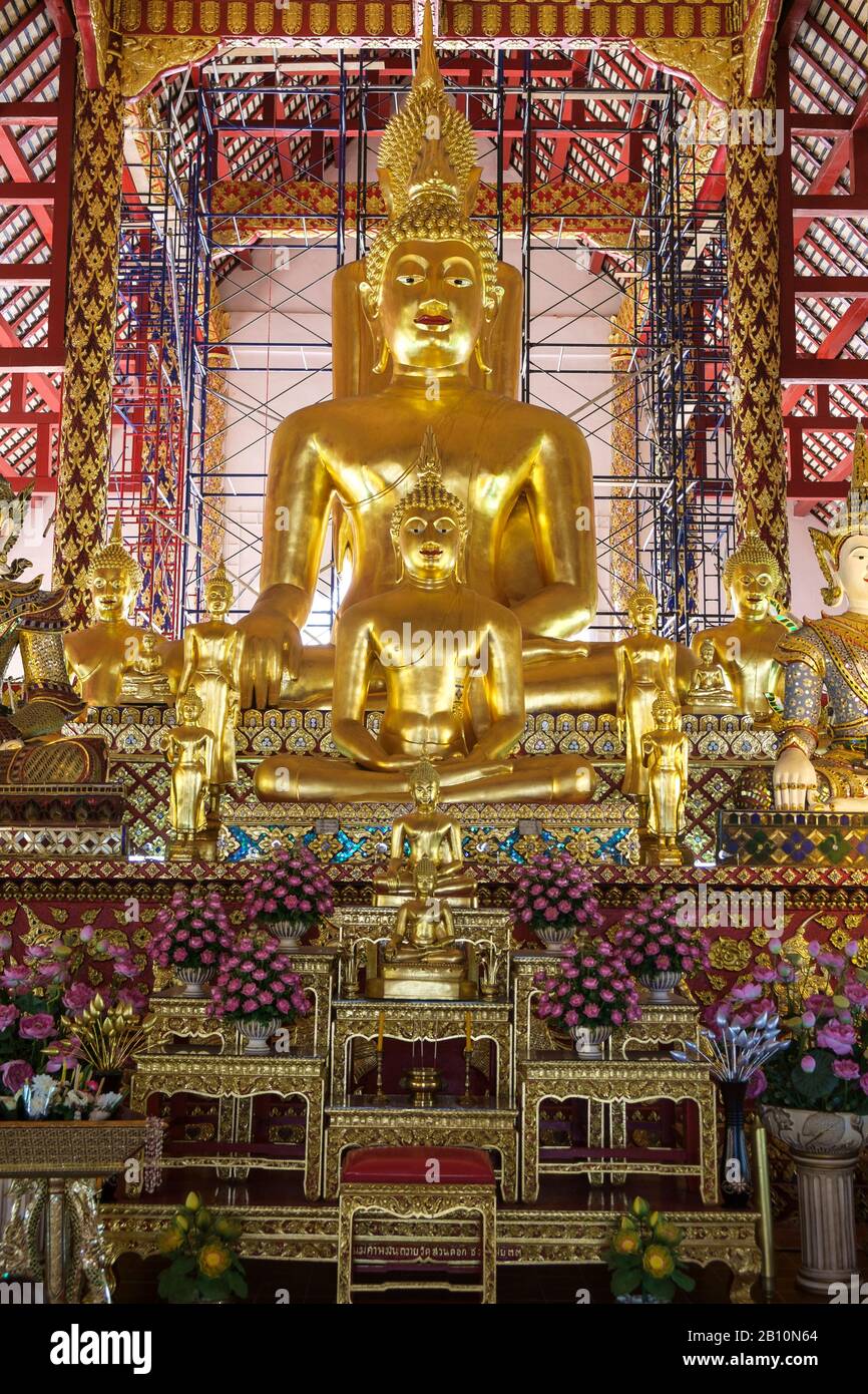 Altar and golden Buddha statue at Viharn Luang Temple, Chiang Mai, Thailand Stock Photo