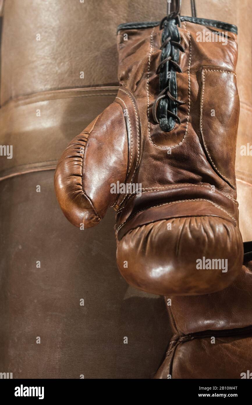 worn out boxing gloves