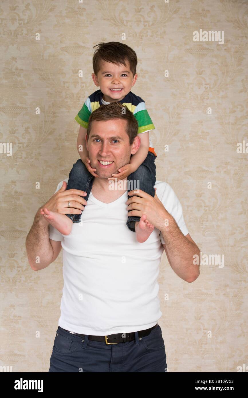 Father carries son on his shoulders Stock Photo Alamy(02)