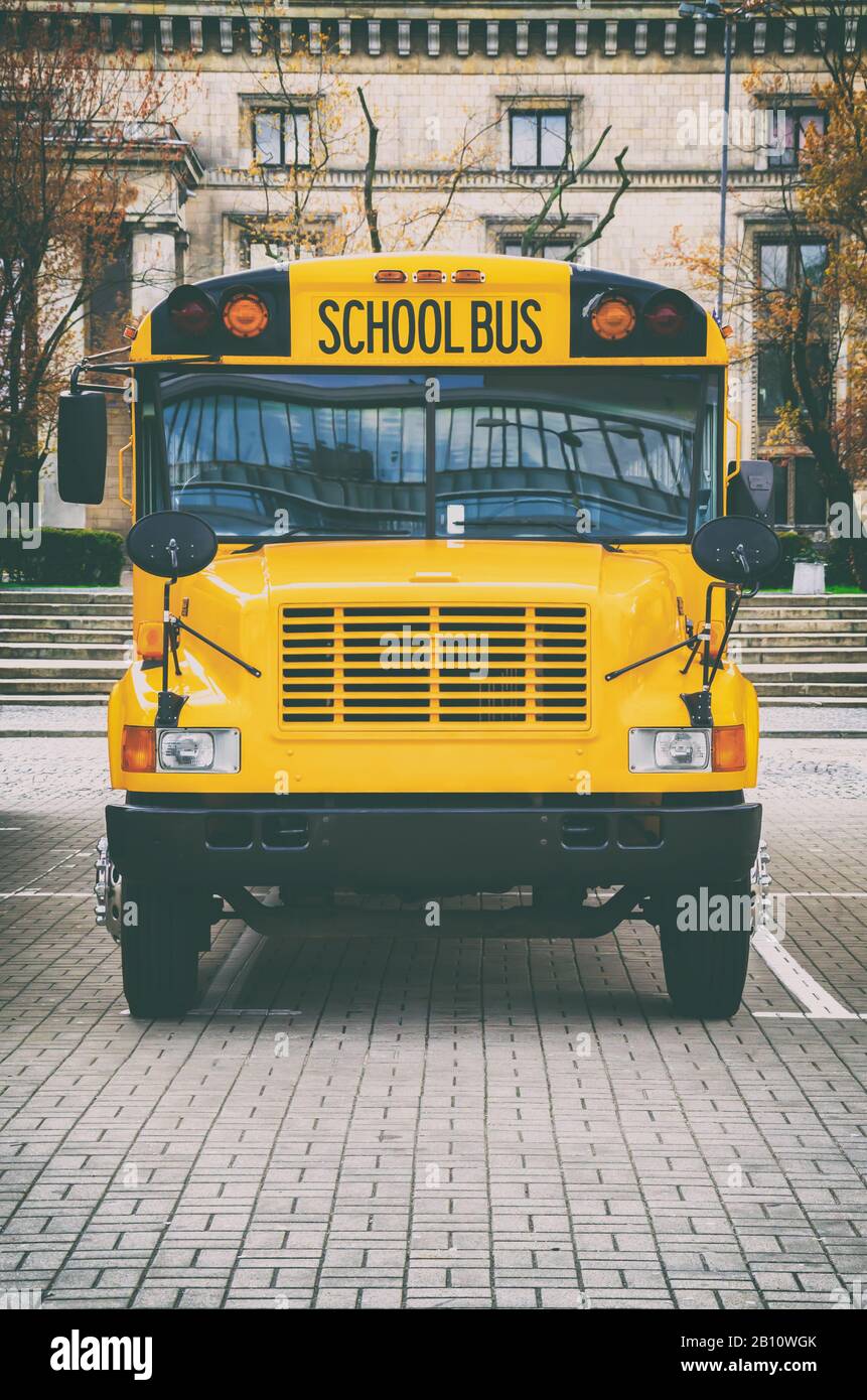 Classic yellow american school bus on the parking Stock Photo - Alamy