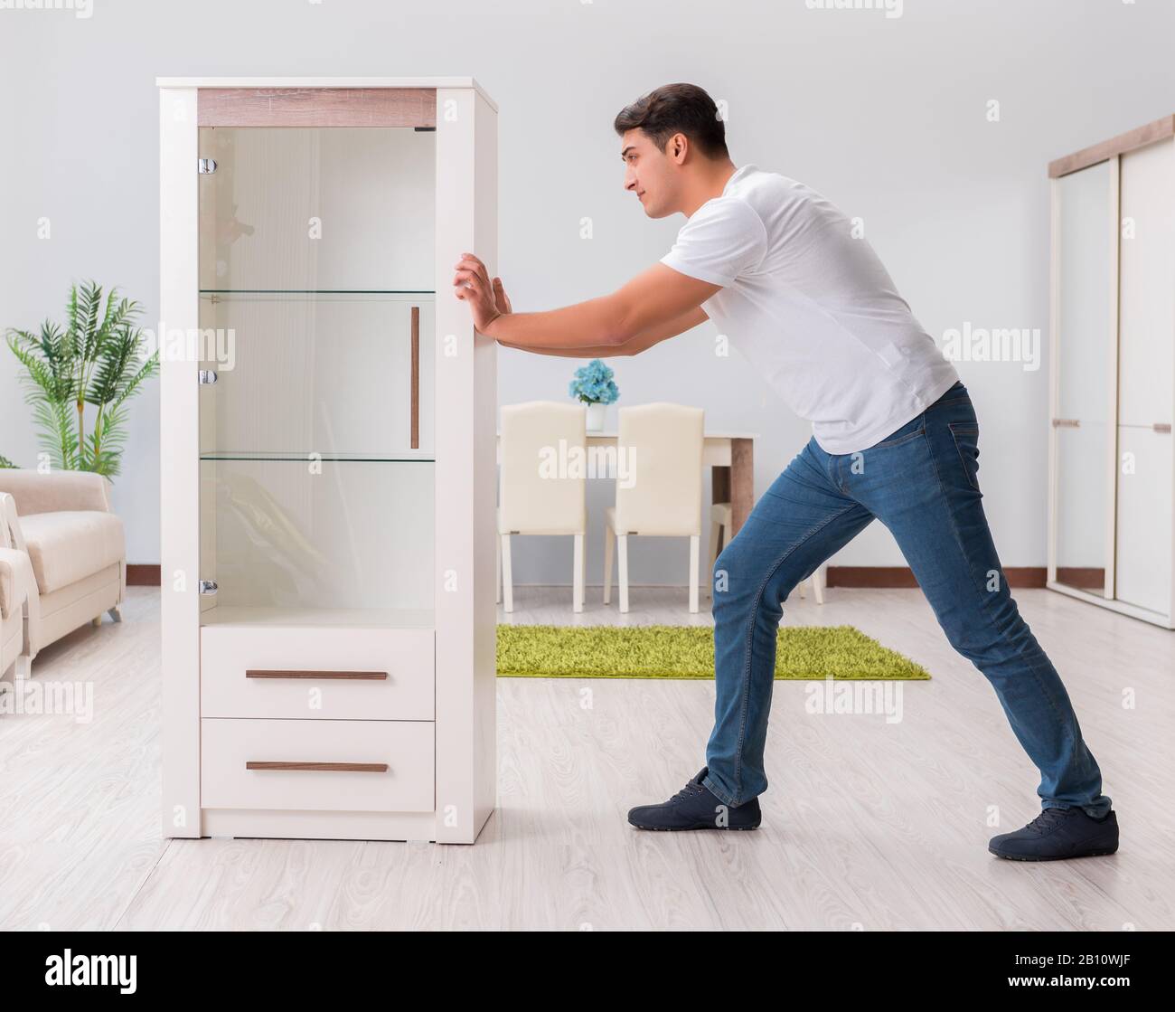 The man moving furniture at home Stock Photo Alamy