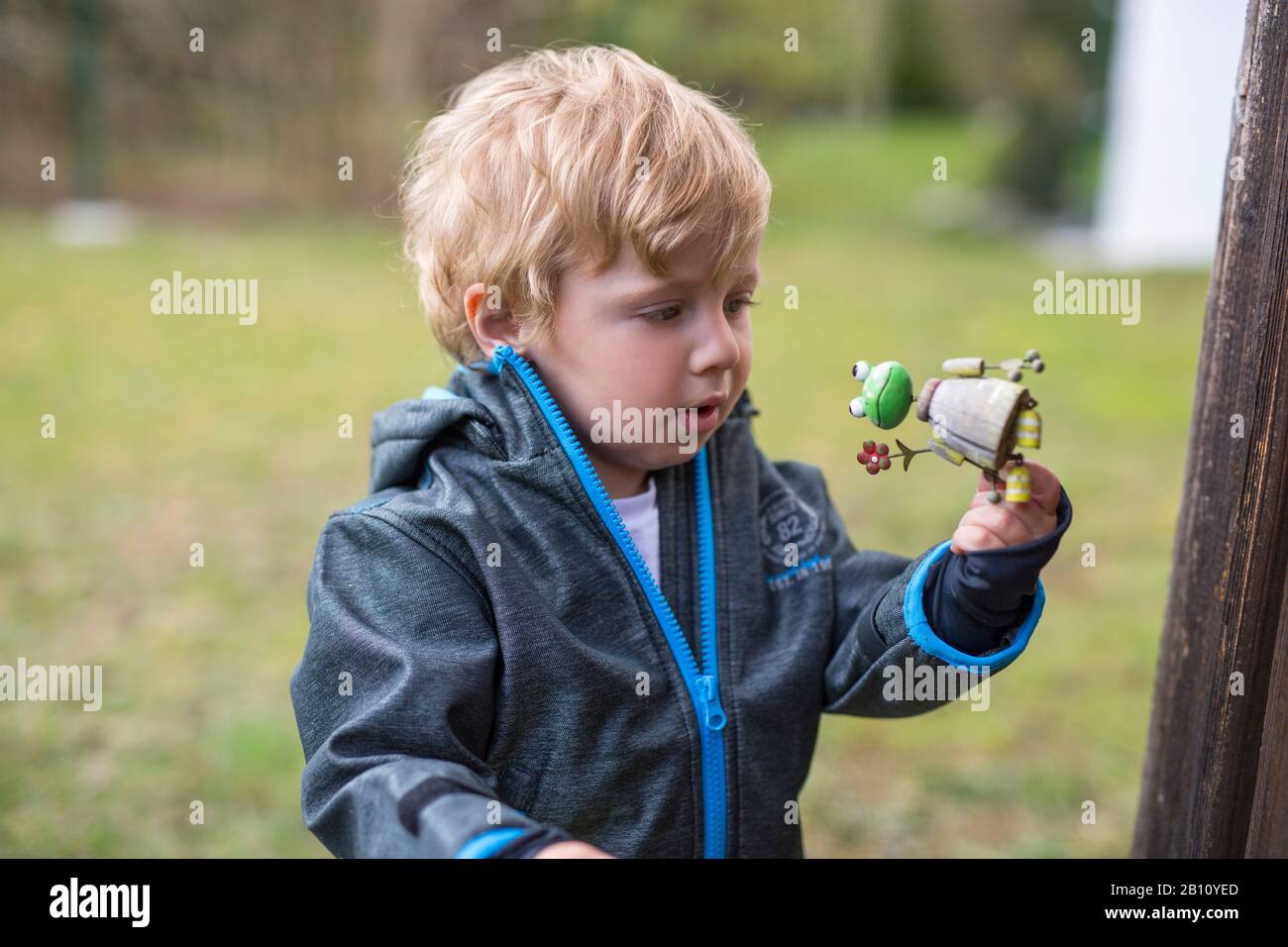 Little boy looks at toys Stock Photo