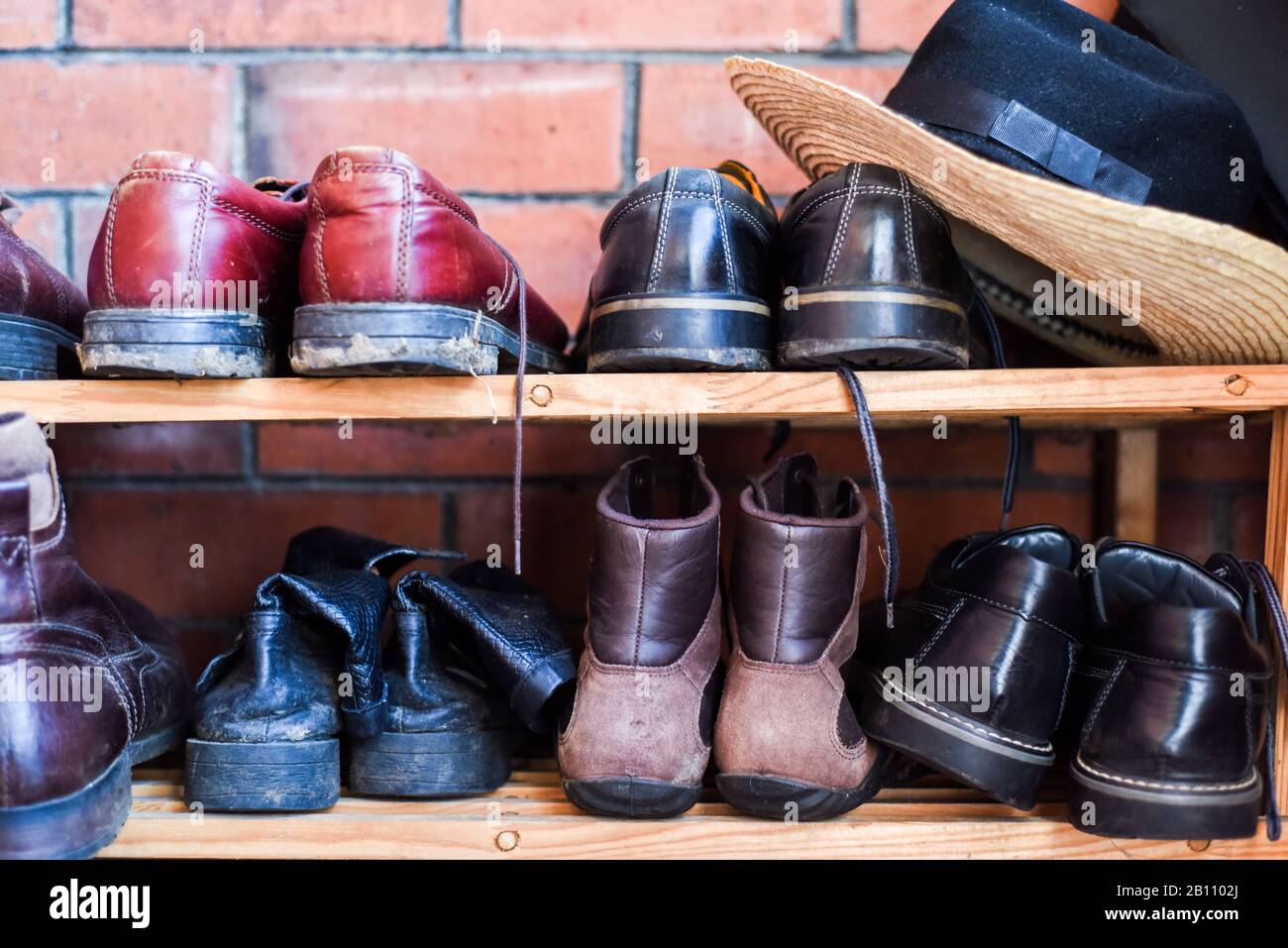 Shoe rack with family storage space for shoes in domestic home Stock Photo