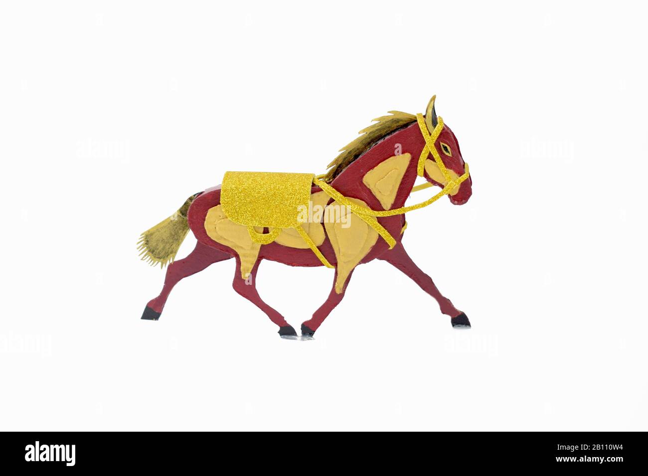 Decorated horse craft made of card-board cut out displayed on an isolated white background Stock Photo