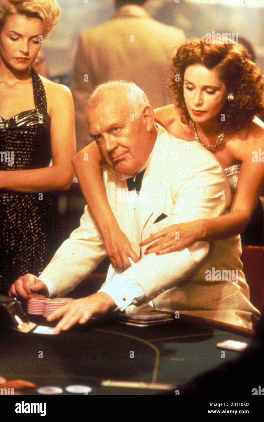 JOSS ACKLAND and KRISTIN SCOTT THOMAS in THE SECRET LIFE OF IAN FLEMING (1990) -Original title: THE SPYMAKER: SECRET LIFE OF IAN FLEMING-, directed by FERDINAND FAIRFAX. Credit: Saban/Scherick Productions / Cortesía Album Stock Photo