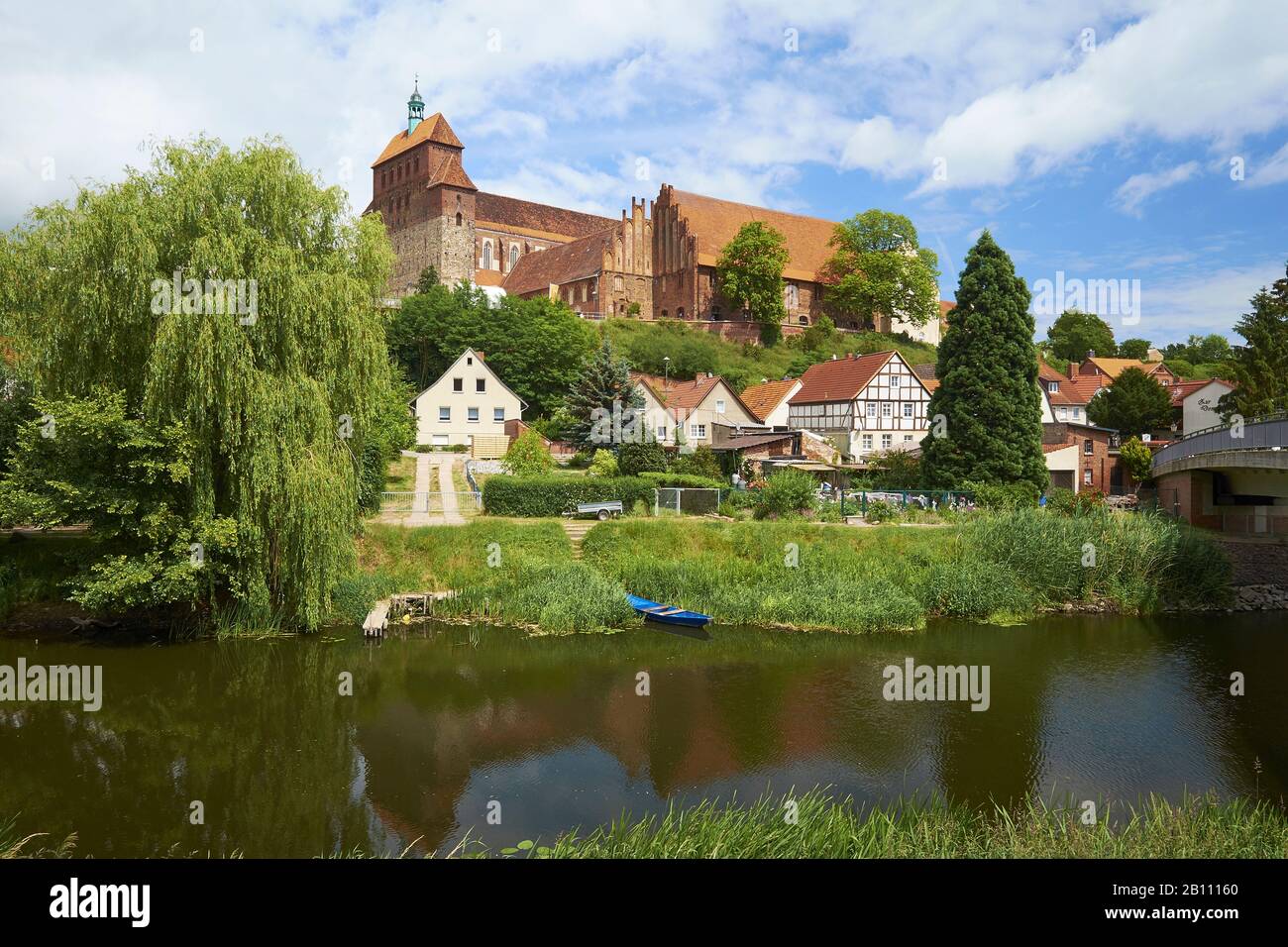 View over Havel side canal to Domberg with cathedral and former Premonstratenserstift St. Marien, Havelberg, Saxony Anhalt, Germany Stock Photo