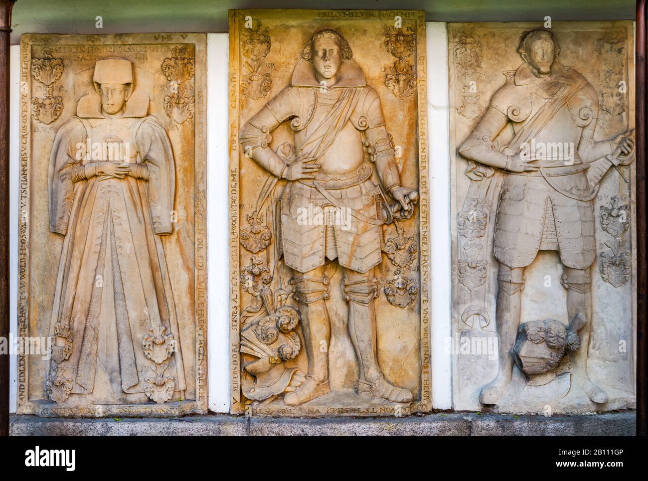 Low reliefs at tombstones inscribed in German, at Church of St John the Baptist in Cieplice Zdroj district of Jelenia Gora, Lower Silesia, Poland Stock Photo