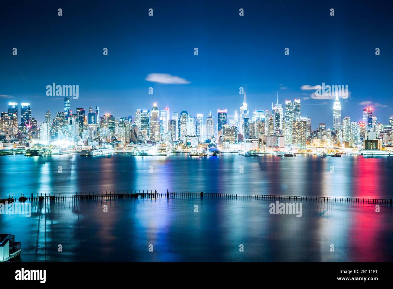 View over the Hudson River to the night skyline of Midtown Manhattan ...