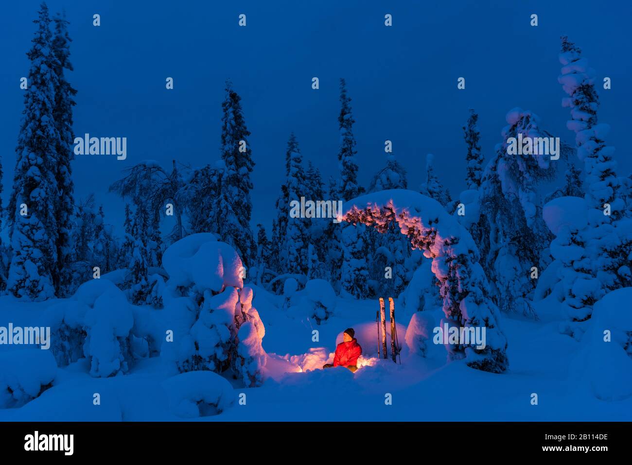 man at a campfire, Sweden, Lapland, Norrbotten, Muddus NP Stock Photo