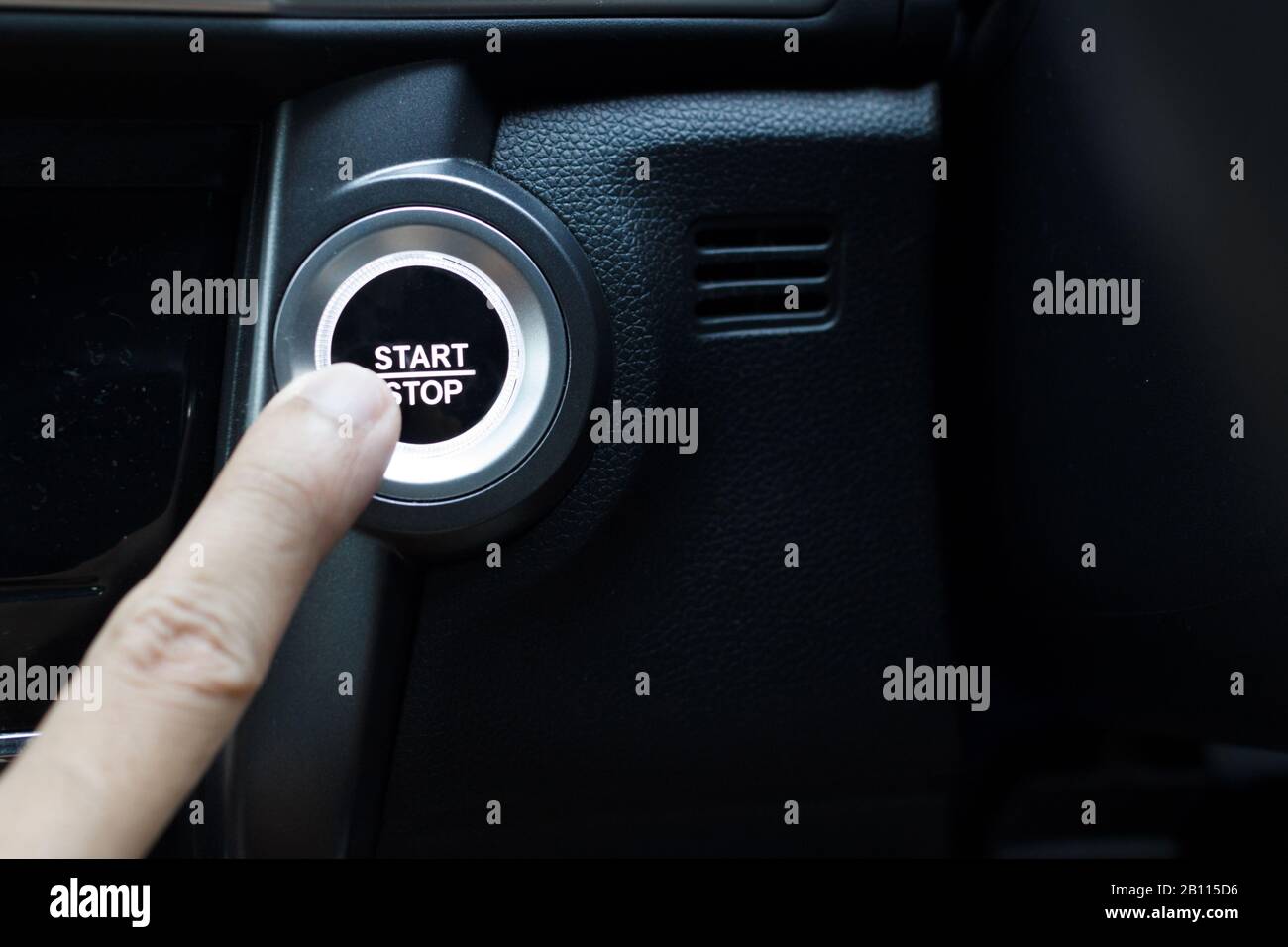 Pressing the button to start a car Stock Photo Alamy