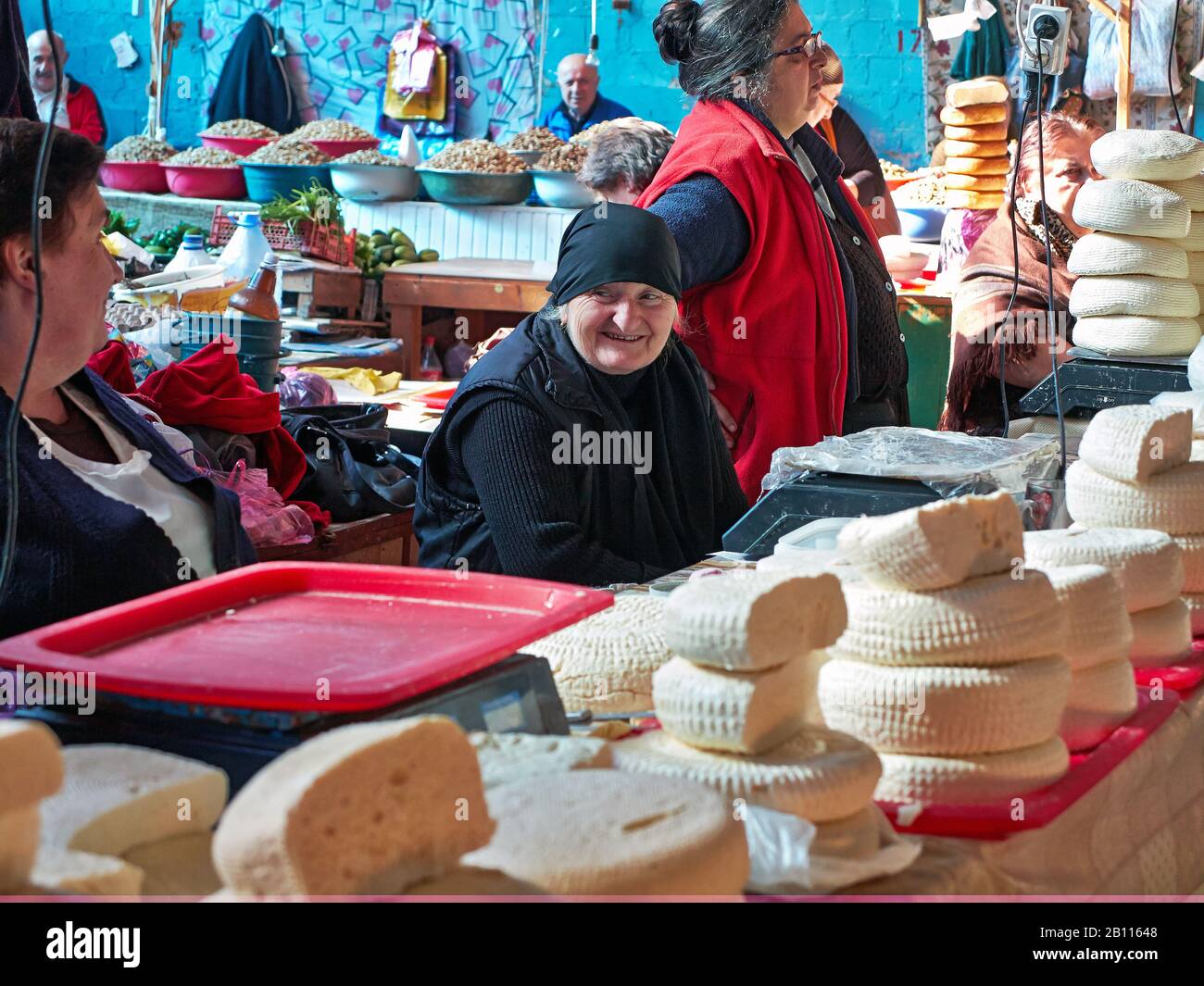 Vendors selling Sulguni brined Georgian cheese at the market in the city of Kutaisi the capital of the western region of Imereti in republic of Georgi Stock Photo