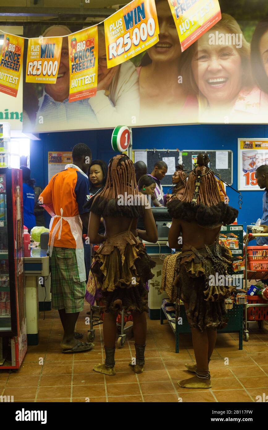 Women from the Himba tribe in the supermarket, Opuwo, Namibia, Africa Stock Photo
